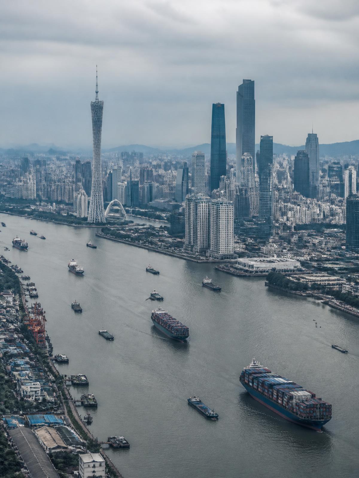 Guangzhou skyline and container ships on the Pearl River